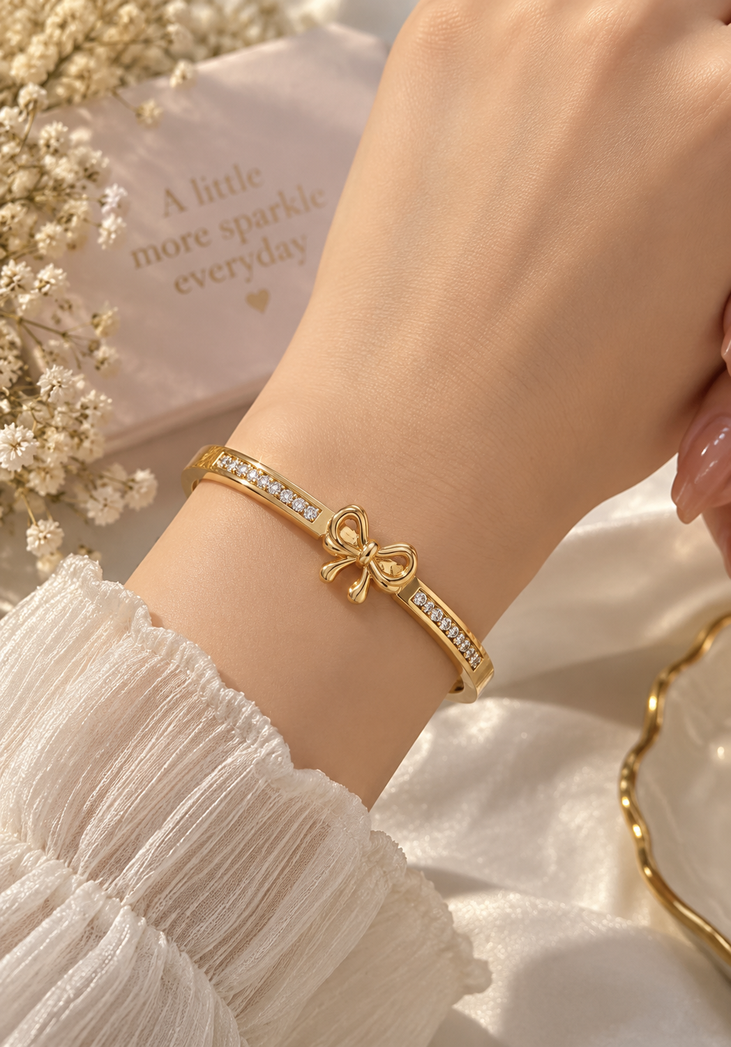 Gold-Tone Bow Bracelet with Sparkling Rhinestones