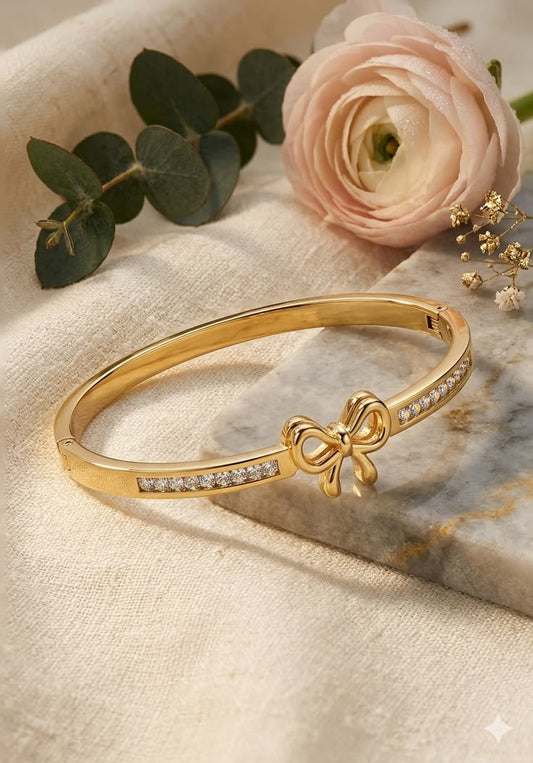 Gold-Tone Bow Bracelet with Sparkling Rhinestones
